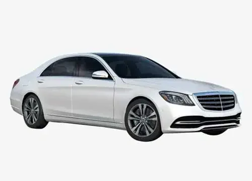 Luxury white Mercedes-Benz sedan for premium Kerala taxi transportation.
